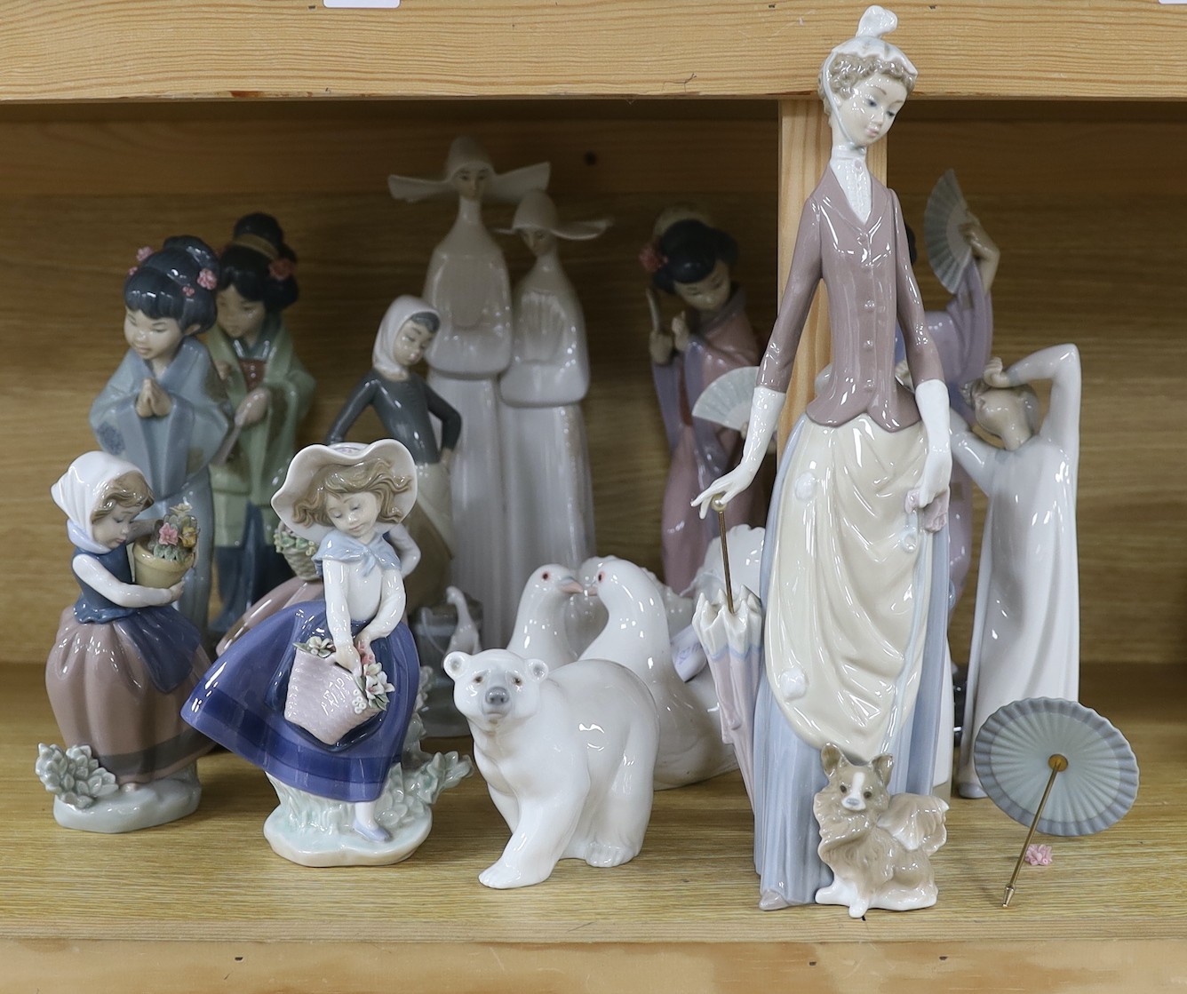 A selection of fifteen Lladro figures, tallest 35cm